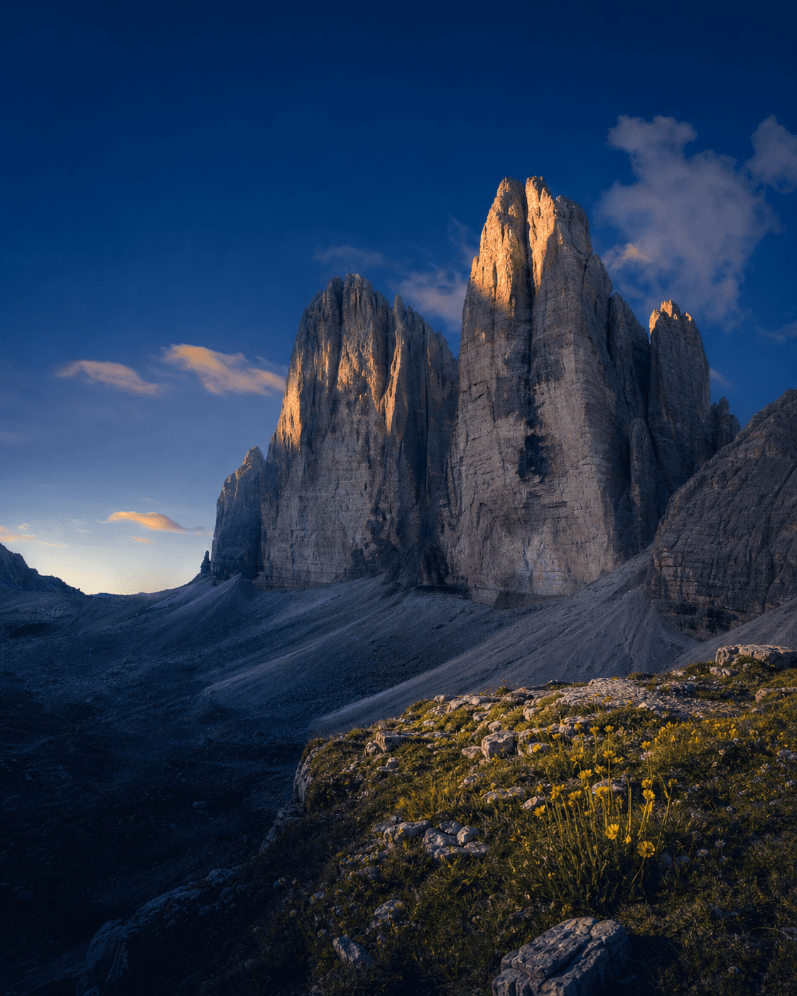 The pale limestone peaks of the Italian Dolomites in warm early light.